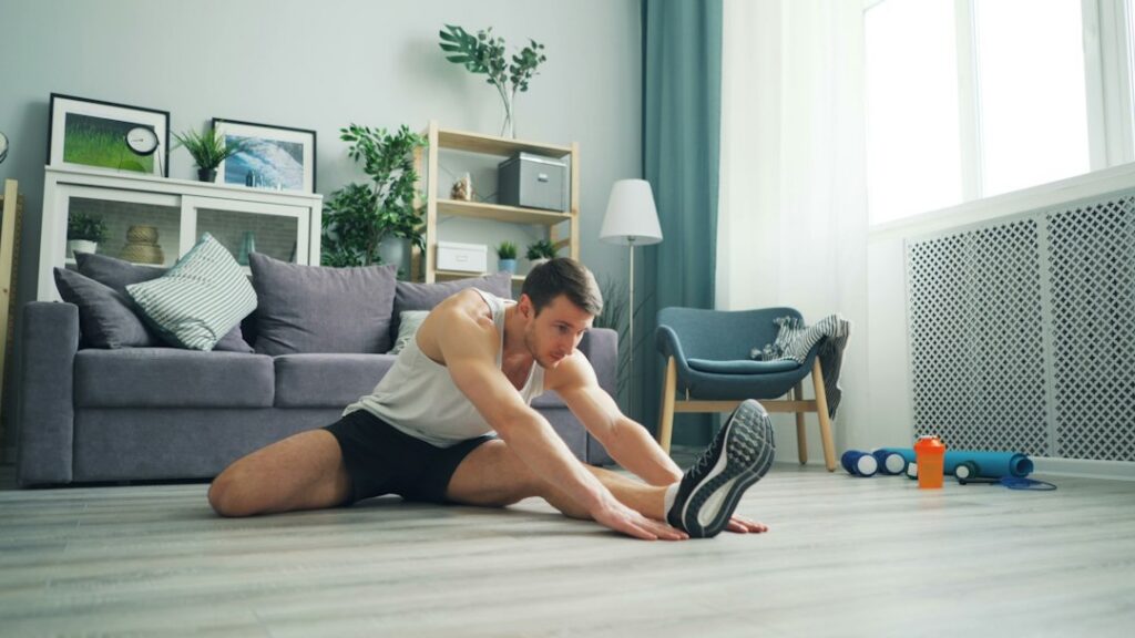 Man assessing soreness after a workout