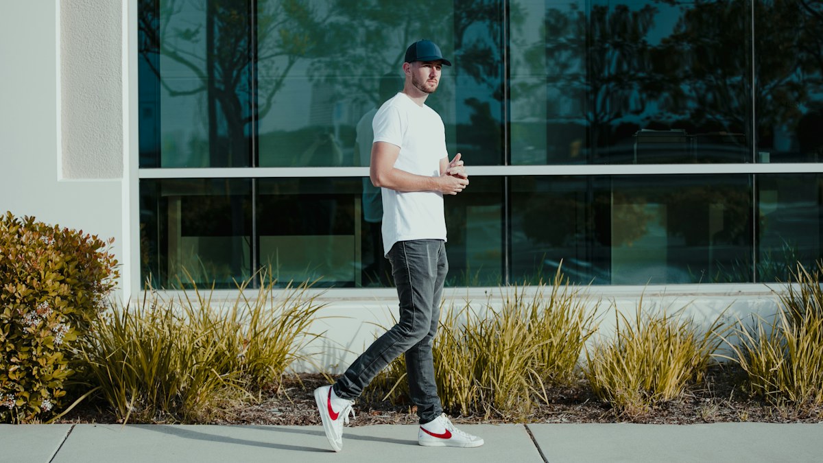 Man walking outdoors in casual clothing