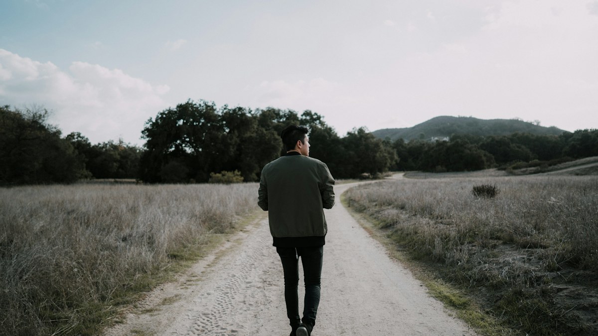 Man walking outdoors as part of an active routine