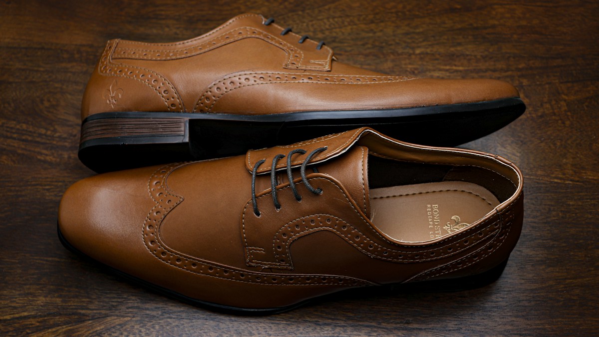 Brown leather lace-up dress shoes photographed close-up