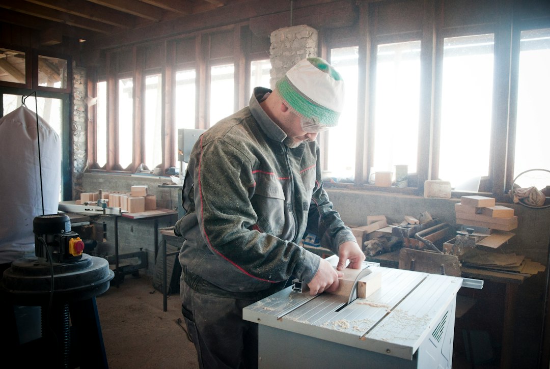 Man using a circular saw in a workshop
