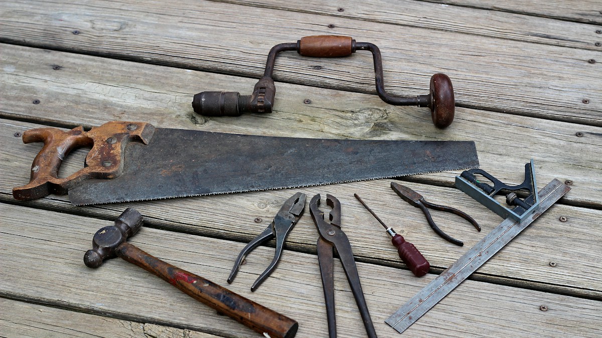 Collection of hand tools arranged for woodworking