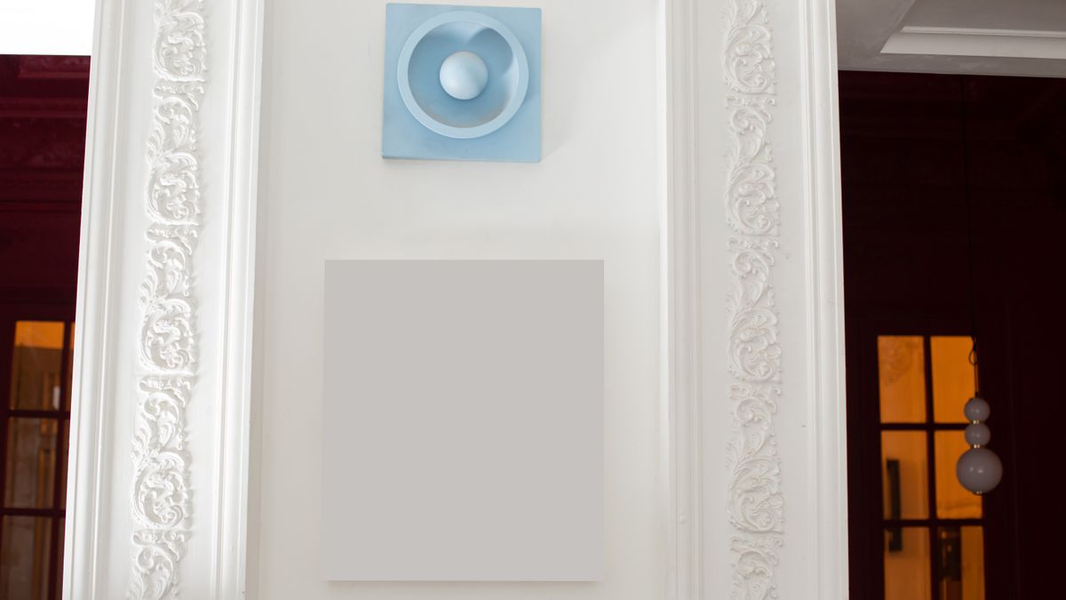 Decorative rectangular moldings on an interior wall, showing how trim adds relief
