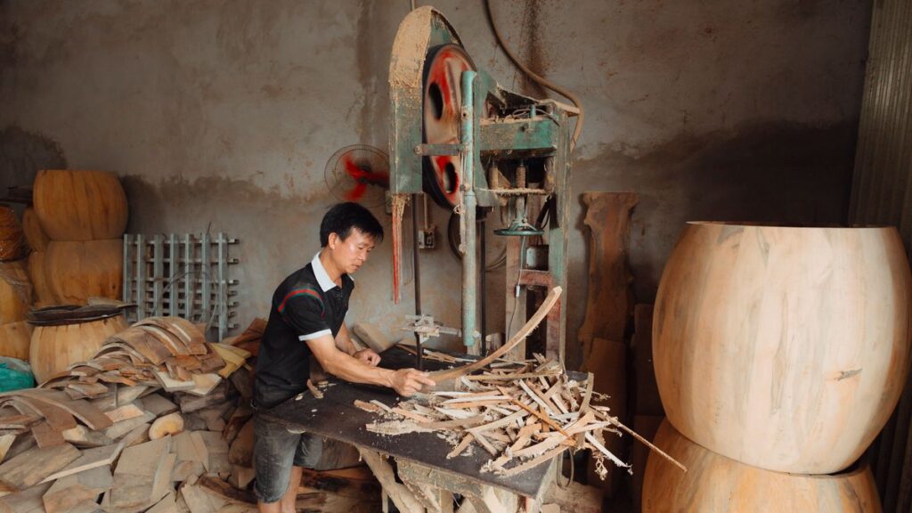 Man preparing woodworking tools in a workshop
