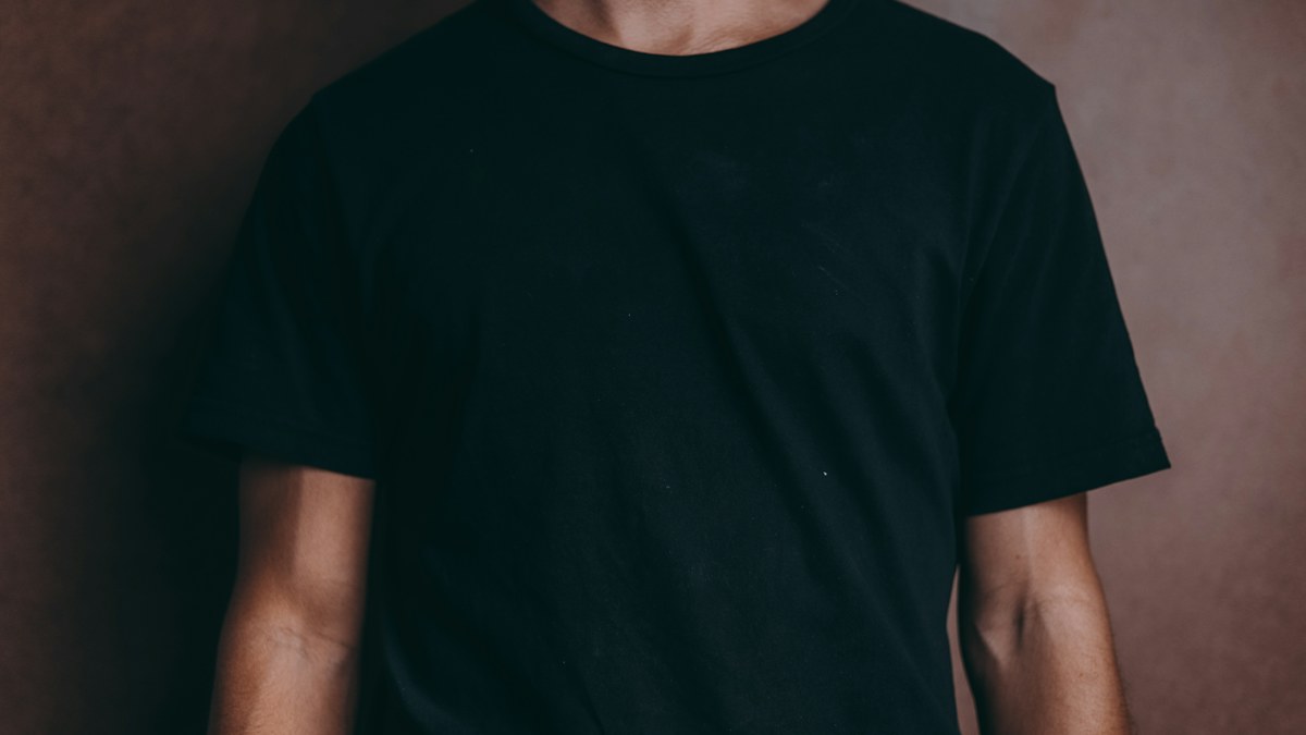 Man wearing a black crew-neck T-shirt