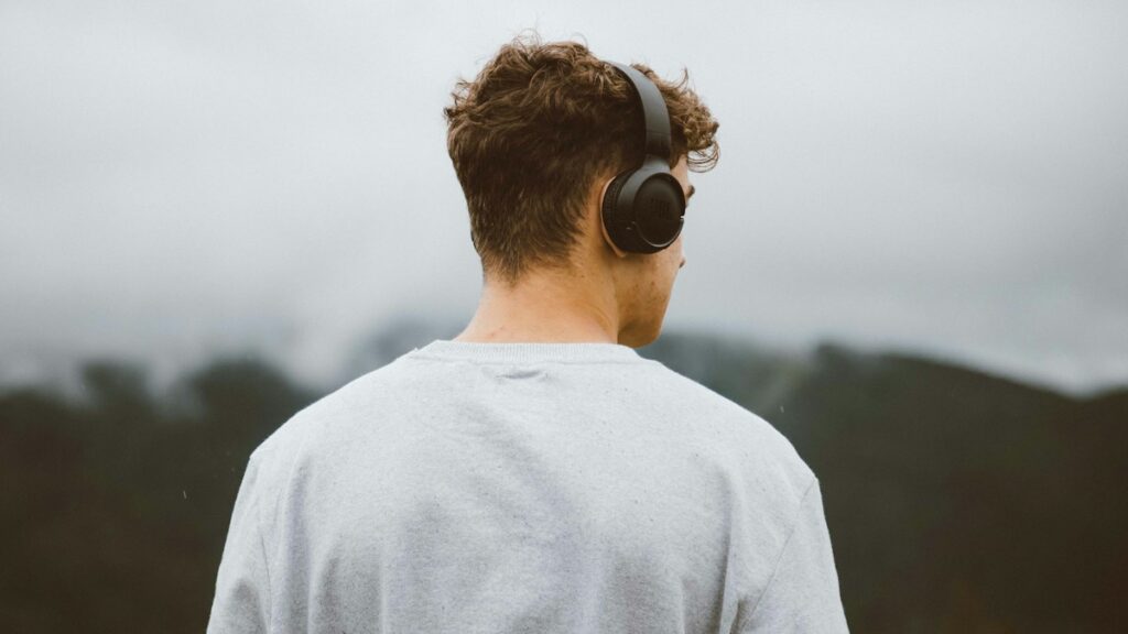 Man wearing headphones outdoors