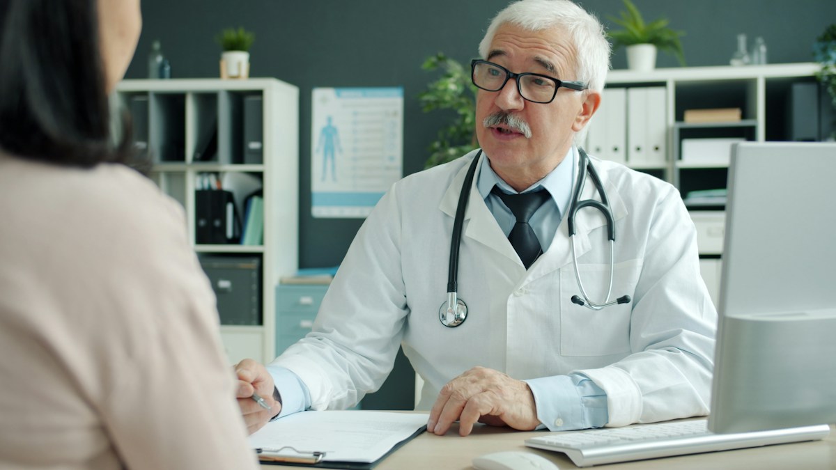 Older man consulting a doctor
