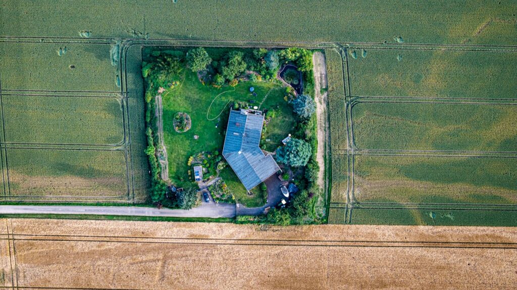 Rural home with green surrounding land
