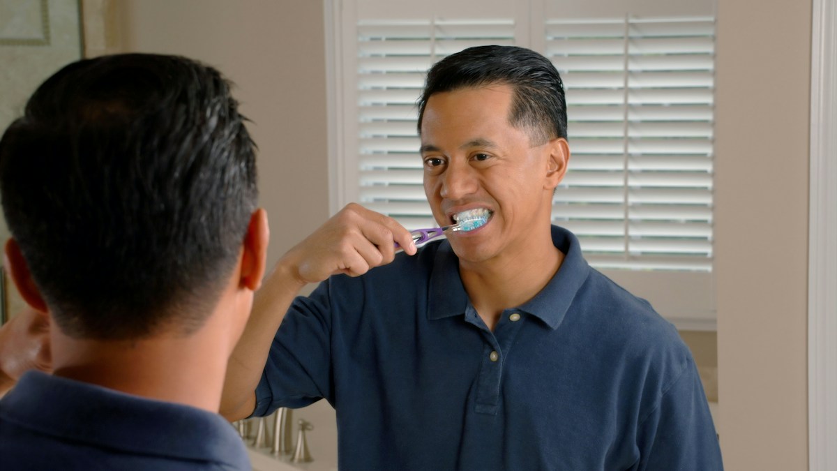 Man brushing teeth