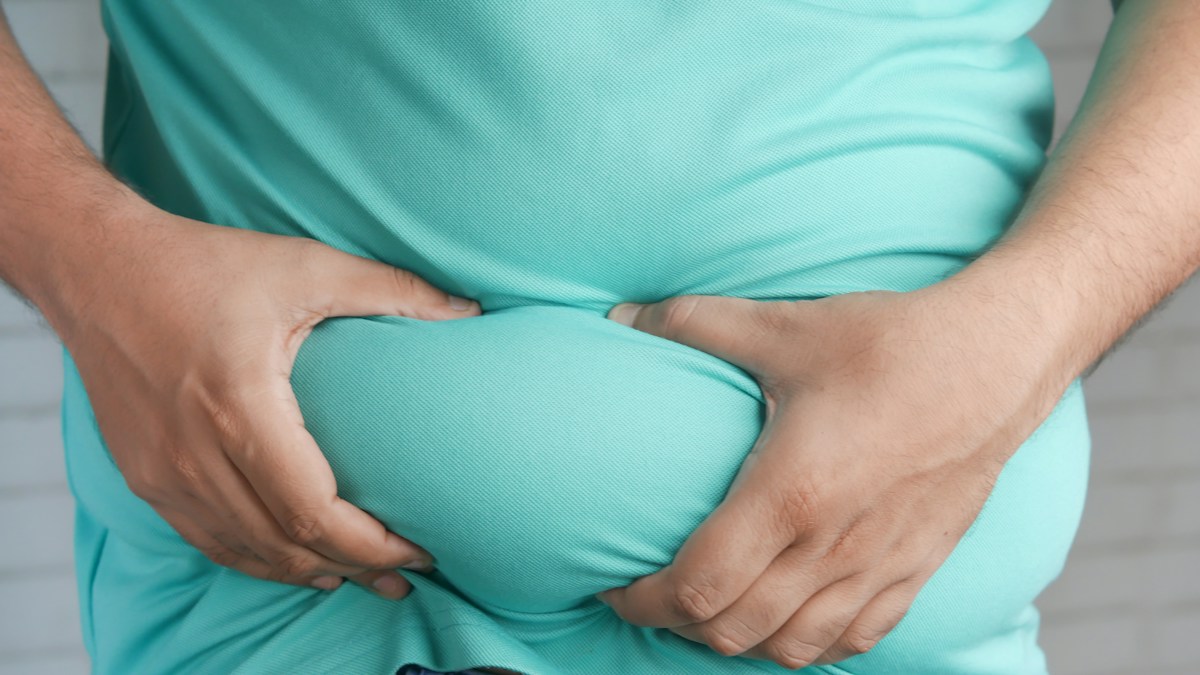 Man holding abdomen