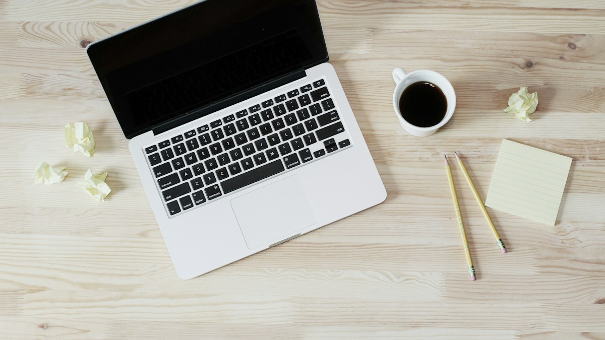 Workspace with computer and planner