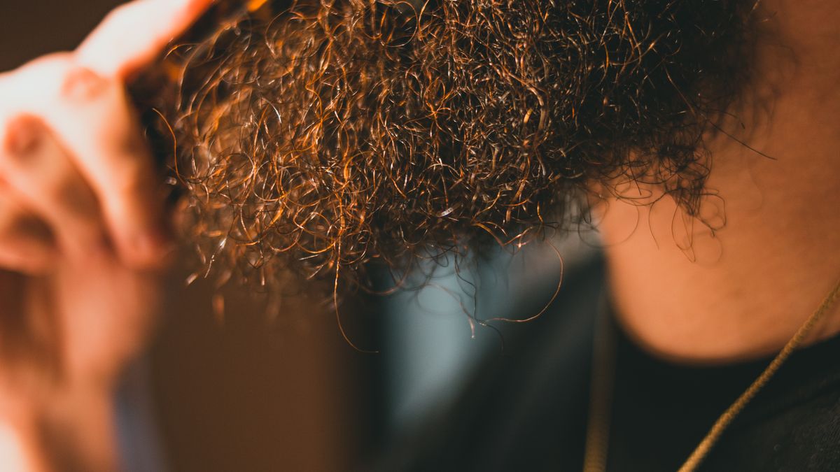 Close-up of a man's curly beard