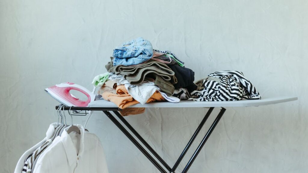 White collared shirts hanging on wooden hangers