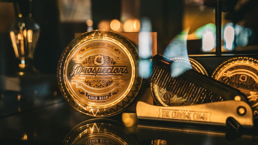 Styling pomade jars displayed on barbershop shelf