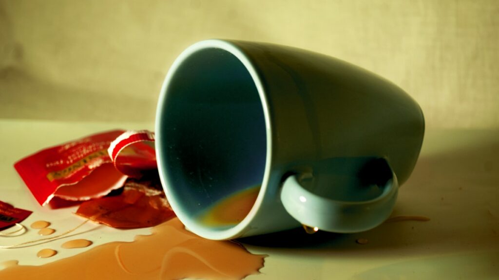 Coffee spilled beside a cup