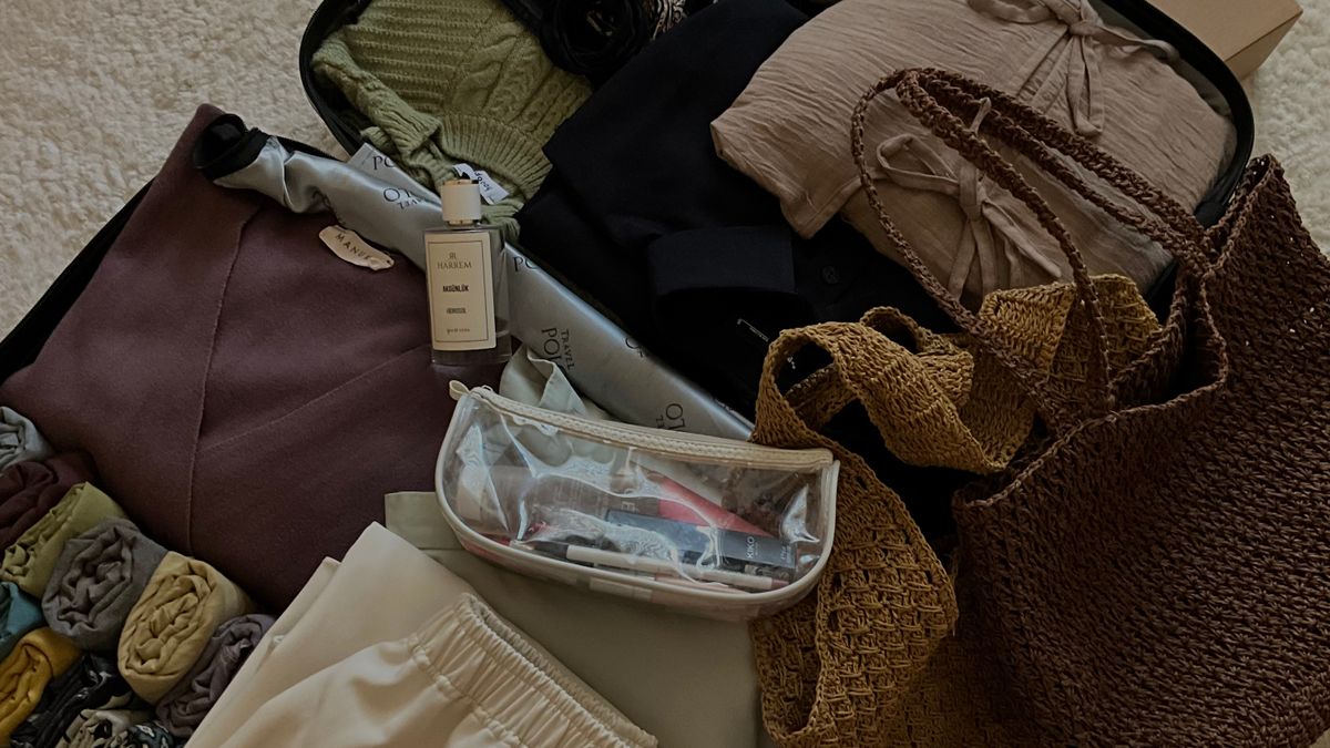 Neatly packed suitcase with travel accessories.