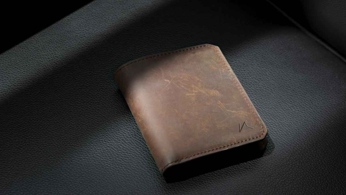 Compact leather wallet and travel everyday-carry essentials