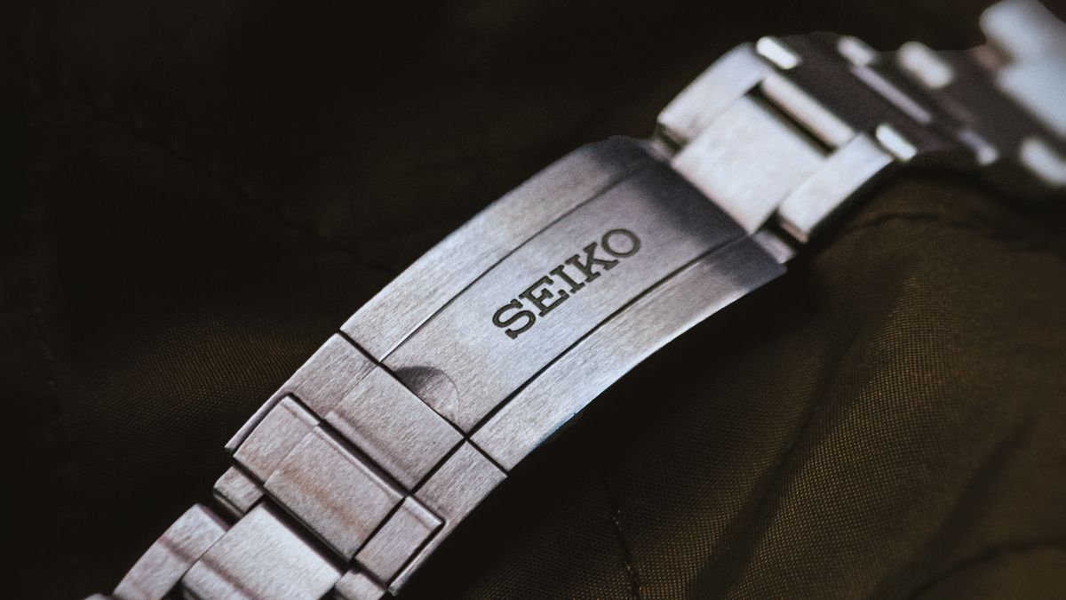 Close-up of a silver wristwatch bracelet and clasp