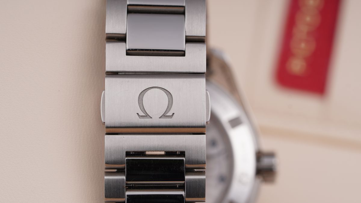 Silver metal clasp and linked watch bracelet close-up