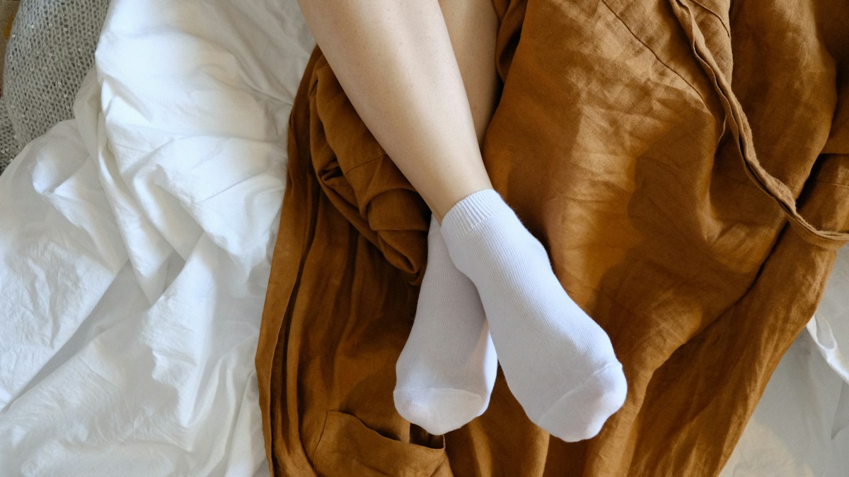 Feet wearing white socks