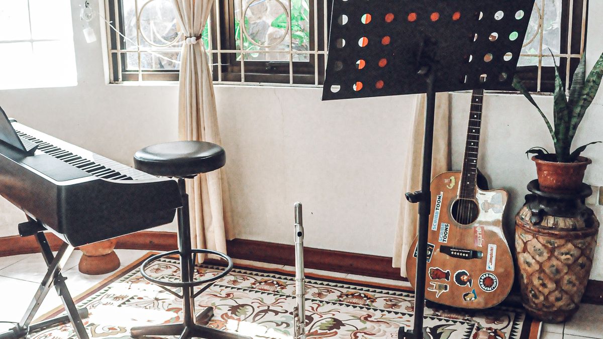 A bright music practice corner with a guitar and other instruments