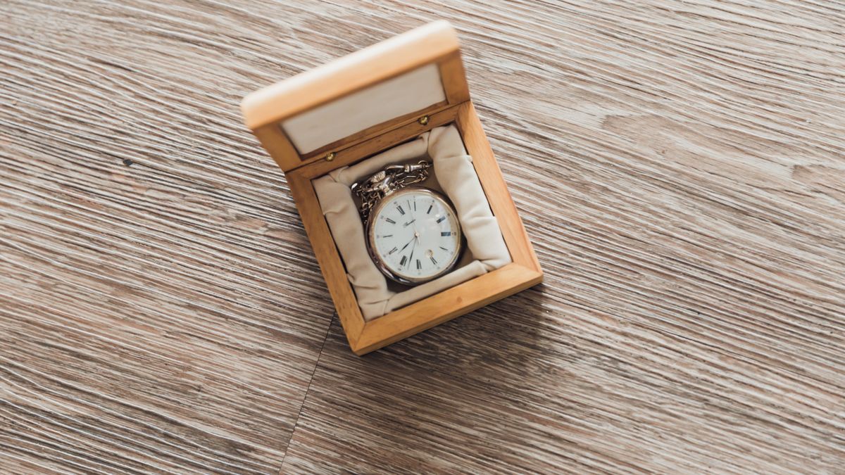 A watch presented in a wooden storage box