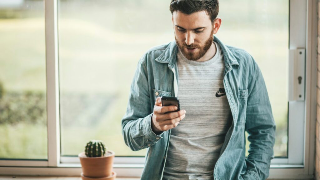 Man texting on a smartphone