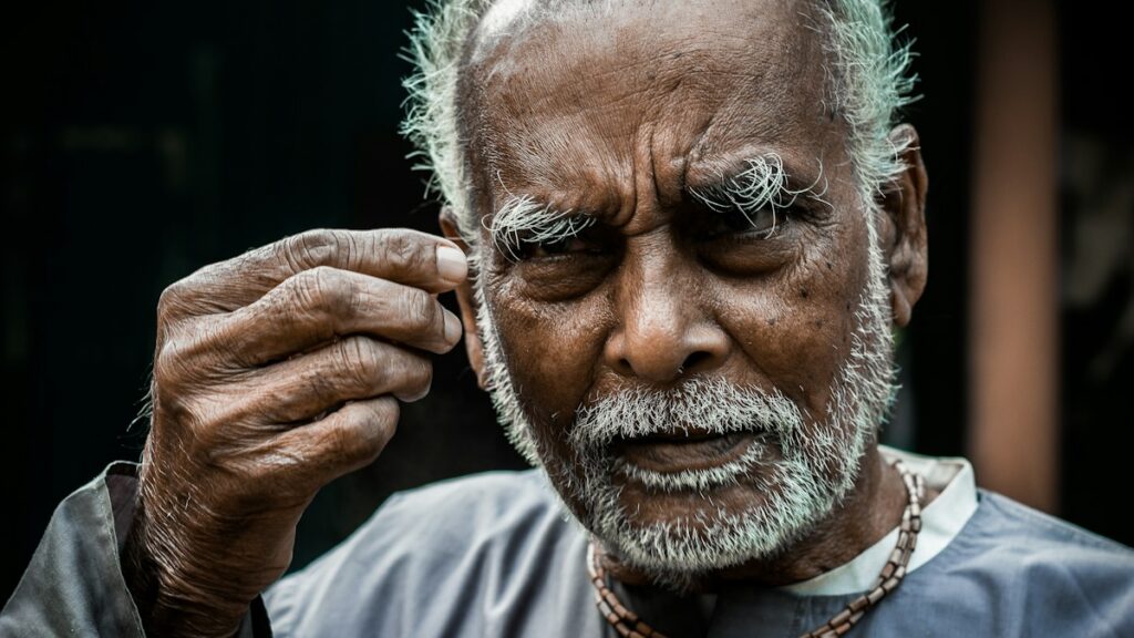 Older man in a thoughtful moment