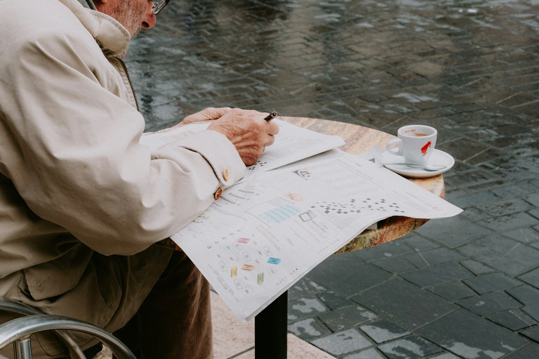 Man writing notes at a table