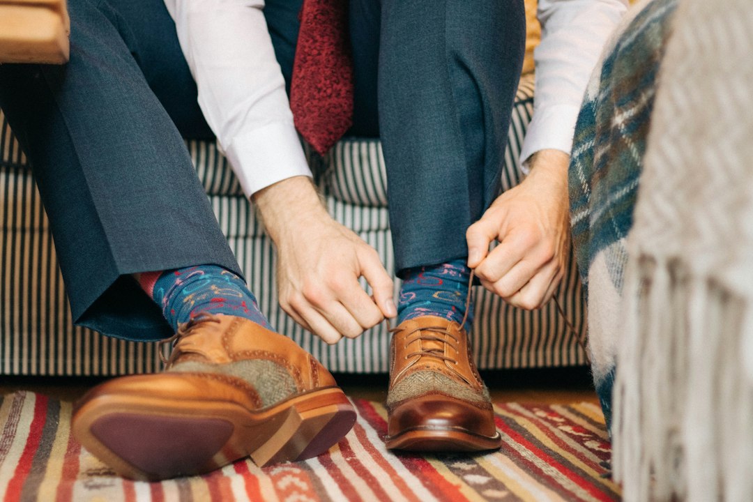 Man tying shoes as part of everyday foot care