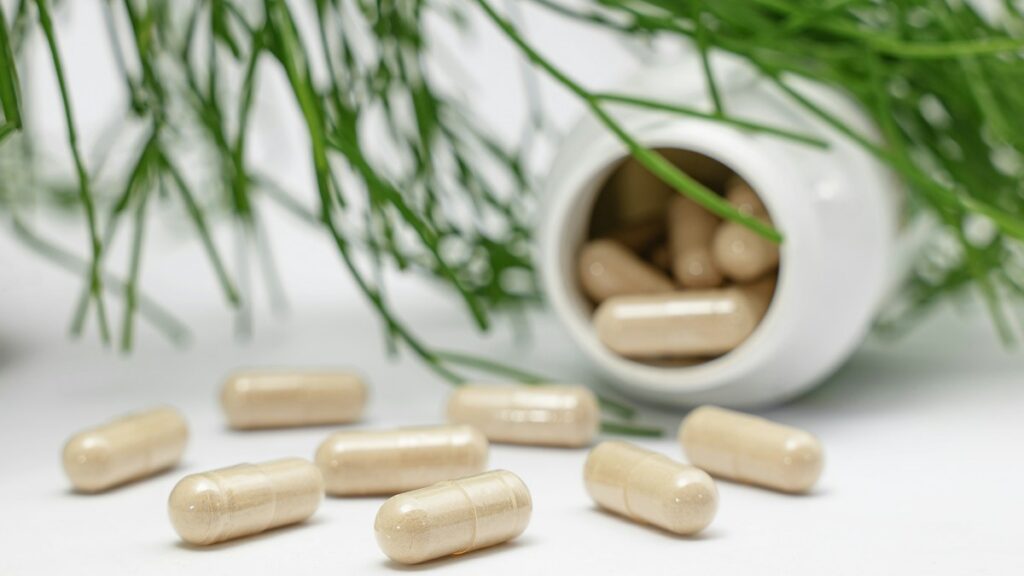 Generic supplement bottle and capsules, illustrative image