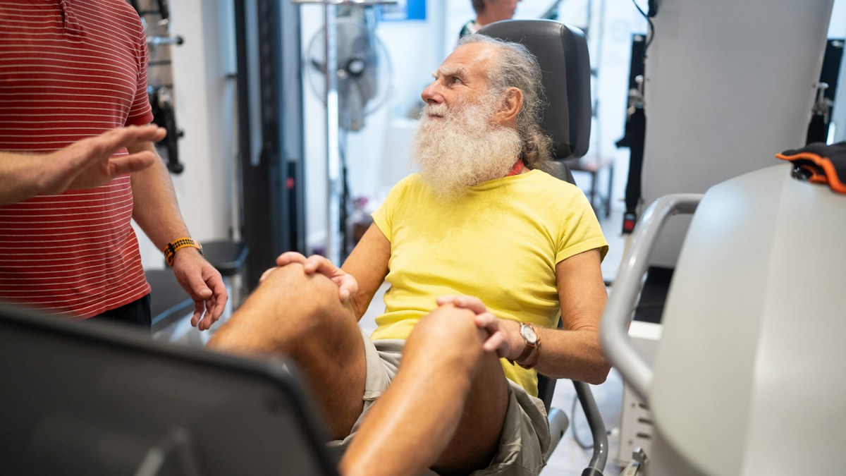 Older man exercising during a strength training session