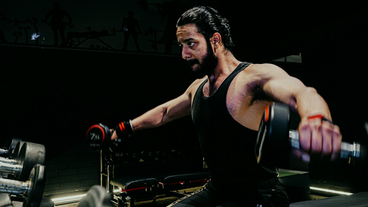 Man lifting a barbell during a gym workout