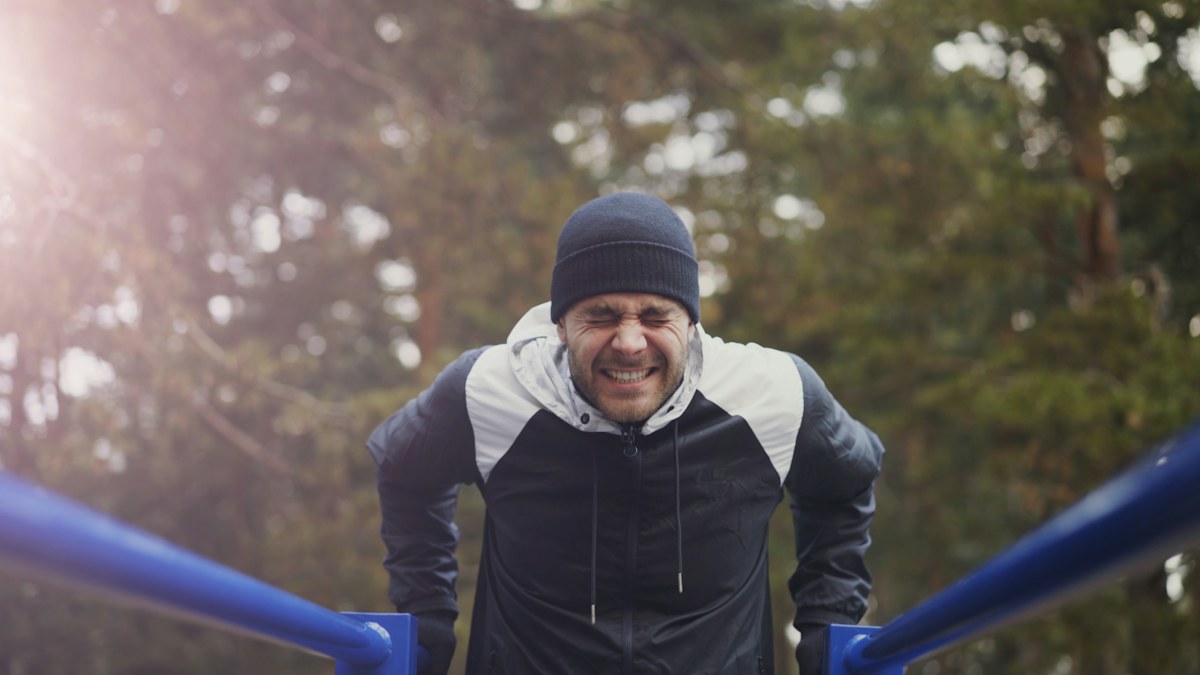 Man doing bodyweight exercise outdoors