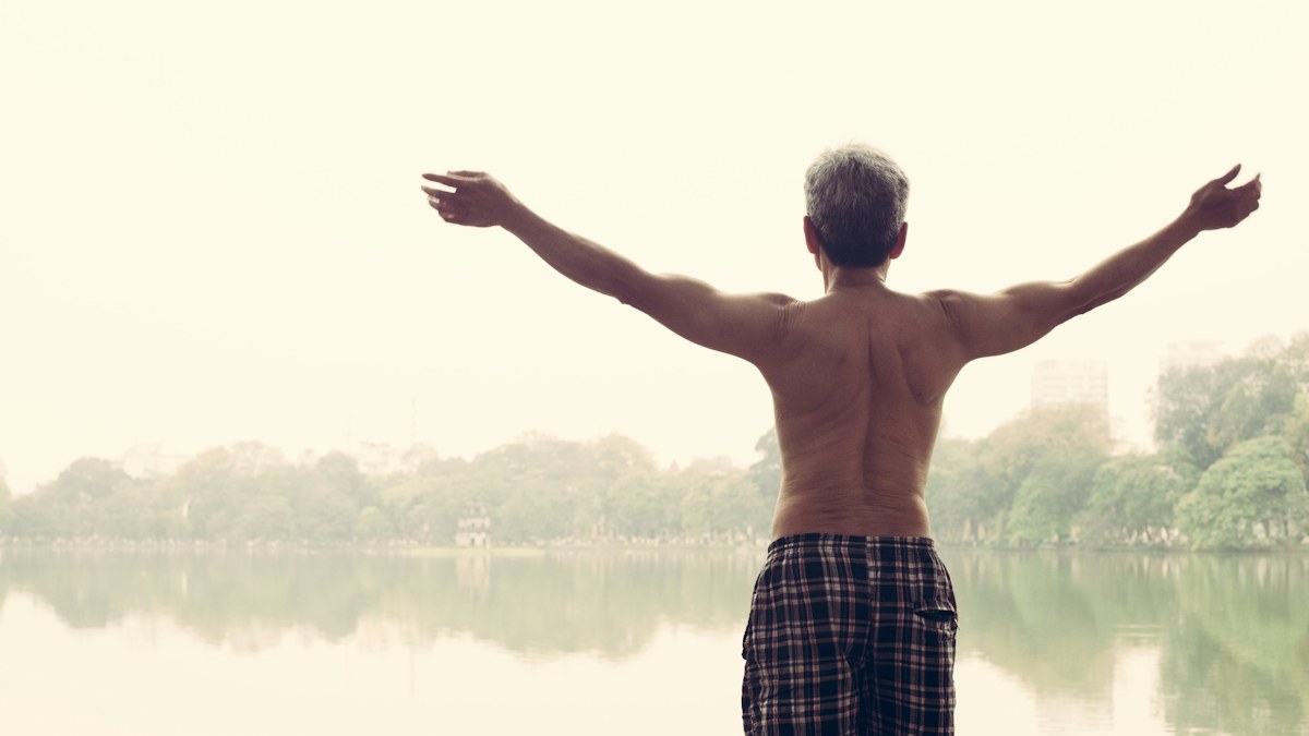 Man exercising outdoors as part of healthy aging