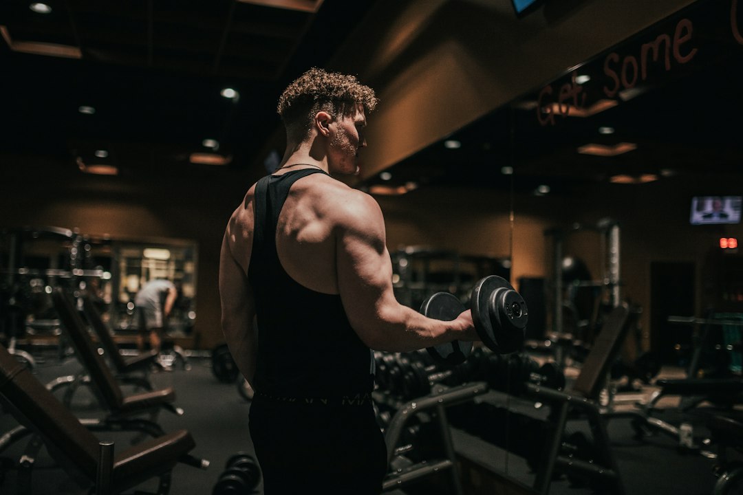 Man strength training in a gym