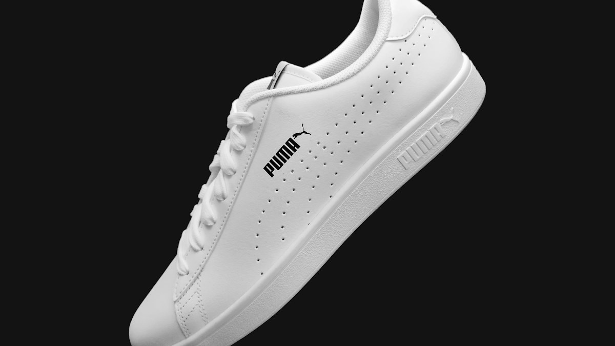 White leather sneakers showing the material that requires gentle wiping